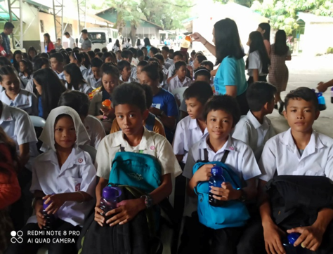 students receiving water bottles during the event